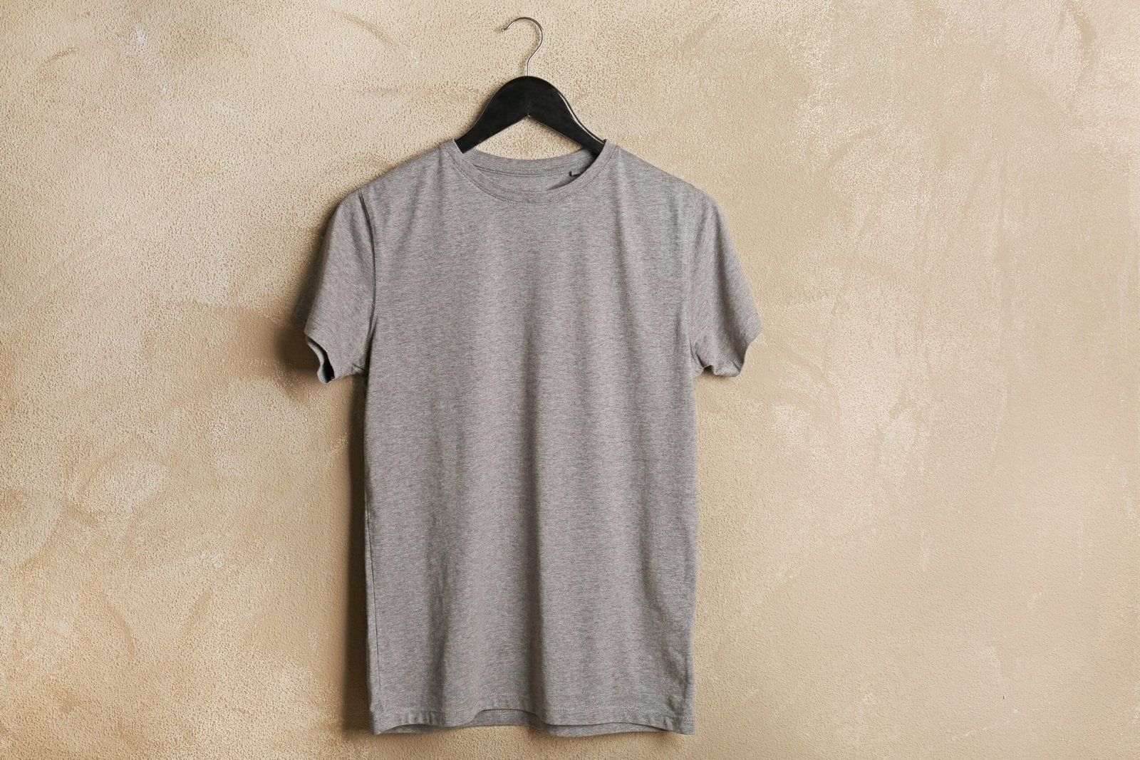 blank grey t shirt on grunge background